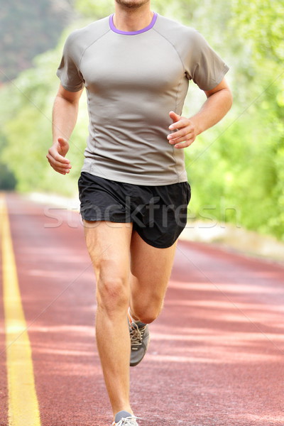 Low Section Of Determined Man Running On Road Stock photo © Maridav