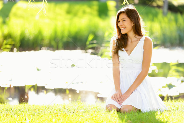 Asian woman sitting in park in spring or summer Stock photo © Maridav