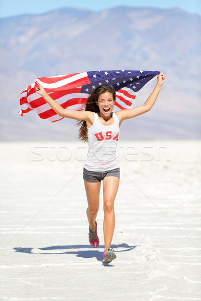 Athlete woman with american flag running Stock photo © Maridav