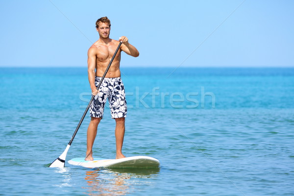 Stand up paddle board man paddleboarding Stock photo © Maridav