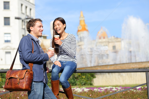 Happy couple drinking coffee talking in Barcelona Stock photo © Maridav