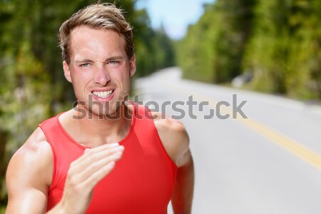 Sportowiec runner człowiek pocenie się uruchomiony plaży Zdjęcia stock © Maridav