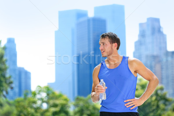 Sport man drinking water bottle in New York City Stock photo © Maridav