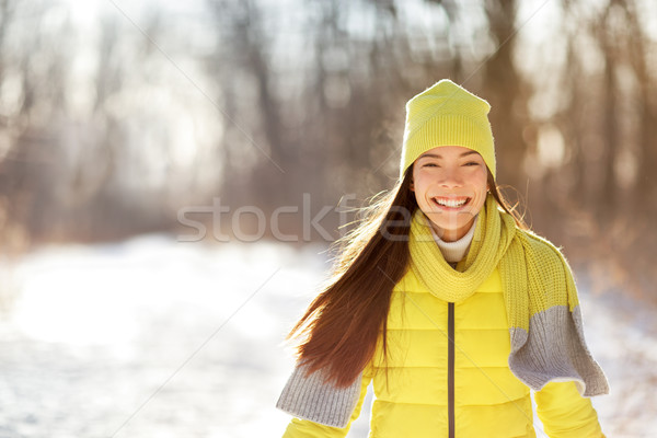 Happy cute winter girl smiling in snow forest Stock photo © Maridav