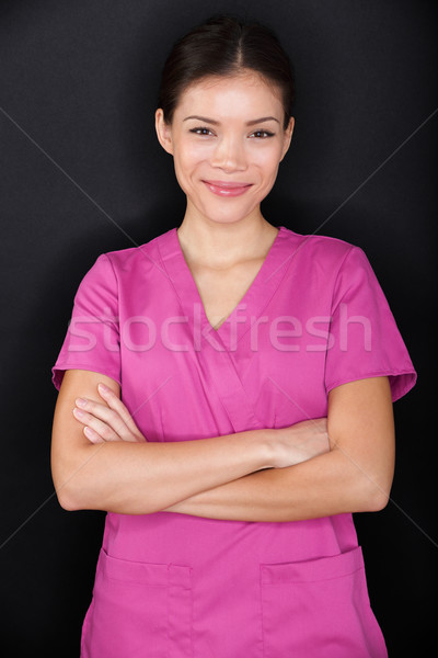 Female nurse portrait happy confident and pink Stock photo © Maridav