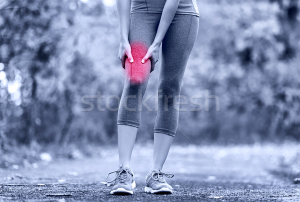 Muscular femeie alergător coapsa femeie Imagine de stoc © Maridav