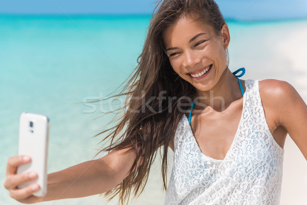 Asian woman fun beach selfie on summer vacation Stock photo © Maridav