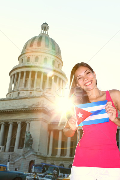 Havana, Cuba - Capitol and tourist with cuban flag Stock photo © Maridav