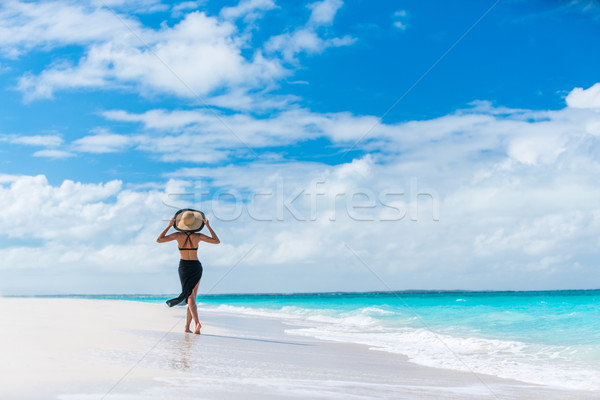 Luxury summer travel beach woman walking by ocean Stock photo © Maridav