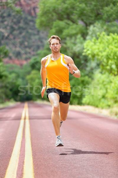 Full Length Of Determined Man Running On Road Stock photo © Maridav