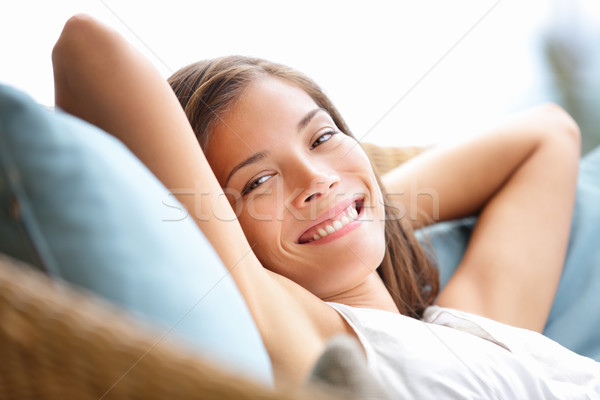 Relaxante mulher sessão confortável sofá salão Foto stock © Maridav