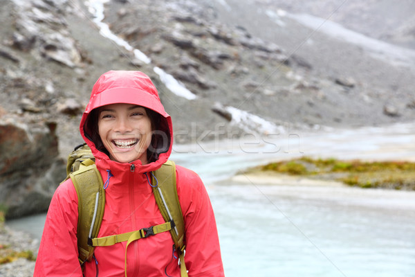 Hiker woman hiking with backpack in rain on trek Stock photo © Maridav