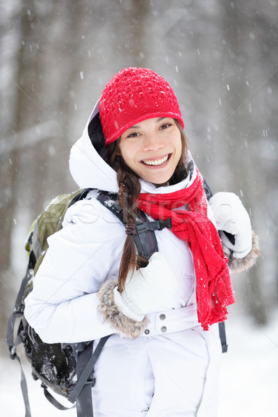 Cheerful Asian woman in falling snow Stock photo © Maridav