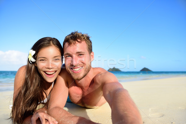 Couple relaxing on beach taking selfie picture Stock photo © Maridav