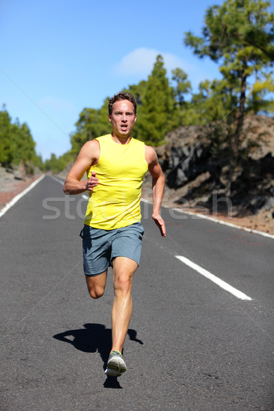 Runner man running sprinting for success on run Stock photo © Maridav