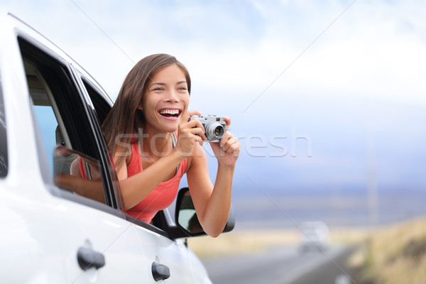 Car road trip tourist taking picture with camera Stock photo © Maridav