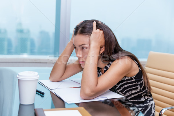 Stressed business woman stressing of office work Stock photo © Maridav