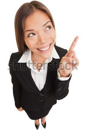 Stock photo: Business woman pointing showing and looking