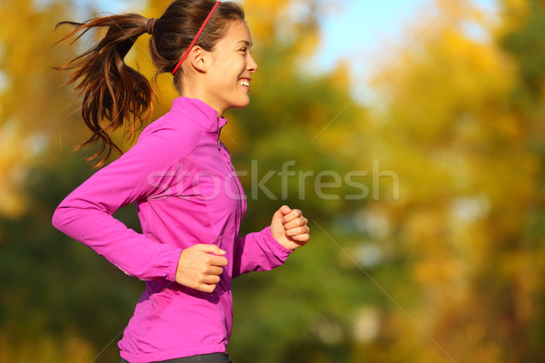 Woman running in autumn fall forest Stock photo © Maridav