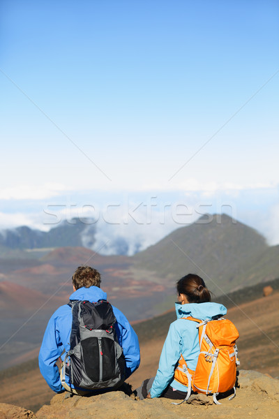 Hikers - people hiking sitting enjoying summit top Stock photo © Maridav