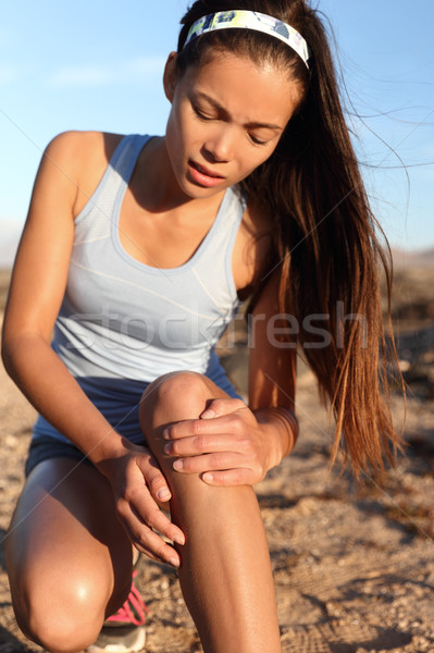 Knee pain running leg injury athlete runner woman Stock photo © Maridav