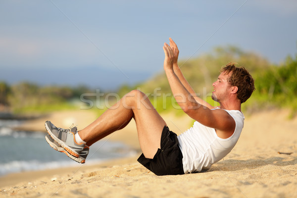 Sit ups - fitness crossfit man doing situps Stock photo © Maridav