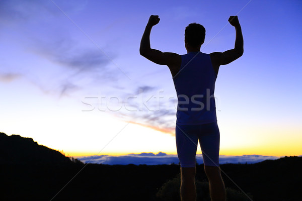 Strength - strong success fitness man flexing Stock photo © Maridav