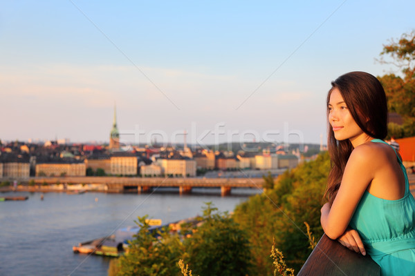 Woman looking at Stockholm old town cityscape view Stock photo © Maridav