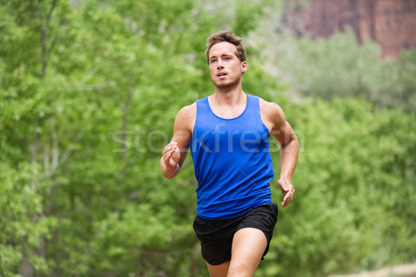 Sport running fitness man training towards goals Stock photo © Maridav