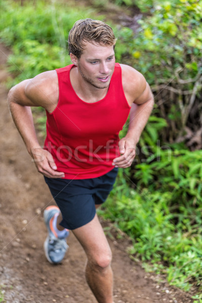 Runner trail running on tough mud path race Stock photo © Maridav