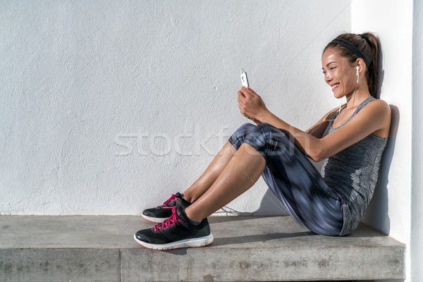Fitness woman listening to phone music motiivation Stock photo © Maridav