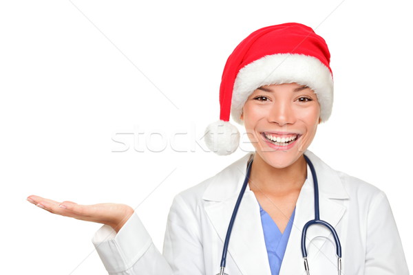 Christmas doctor showing holding hand palm open Stock photo © Maridav