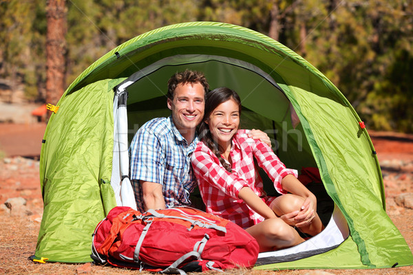 Couple camping in tent happy in romance Stock photo © Maridav