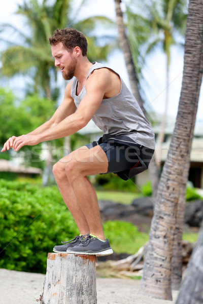 Fitness athlete bench jump squat jumping outside Stock photo © Maridav