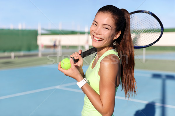 Happy girl with racquet and ball on tennis court Stock photo © Maridav