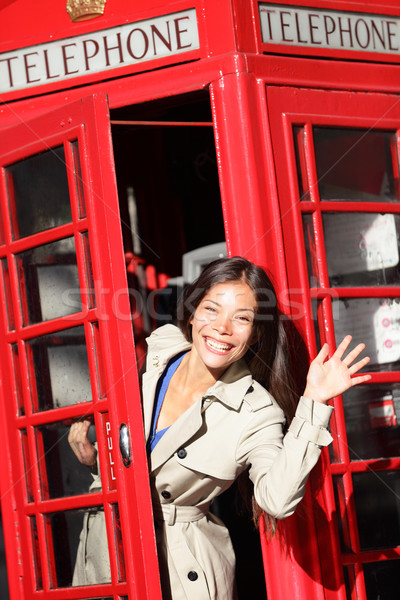 London red phone booth - woman waving happy Stock photo © Maridav