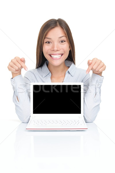 商業照片: 女子 · 顯示 · 上網本 · 筆記本電腦 · 興奮 · 坐在