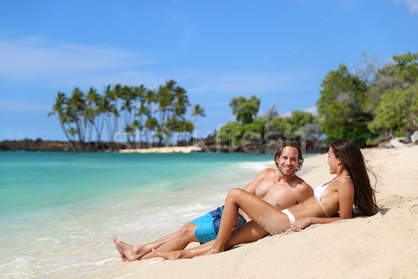 Couple relaxing on suntan beach vacation holiday Stock photo © Maridav