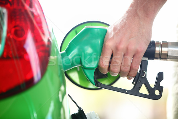 Gas station pump - filling gasoline in green car Stock photo © Maridav