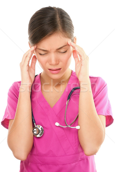 Nurse with headache and stress Stock photo © Maridav