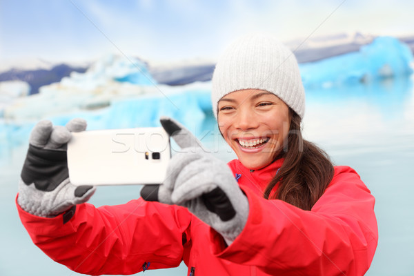 Woman taking selfie photo by Jokulsarlon Iceland Stock photo © Maridav