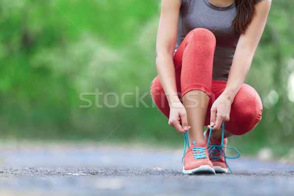 Running shoes - closeup of woman tying shoe laces Stock photo © Maridav