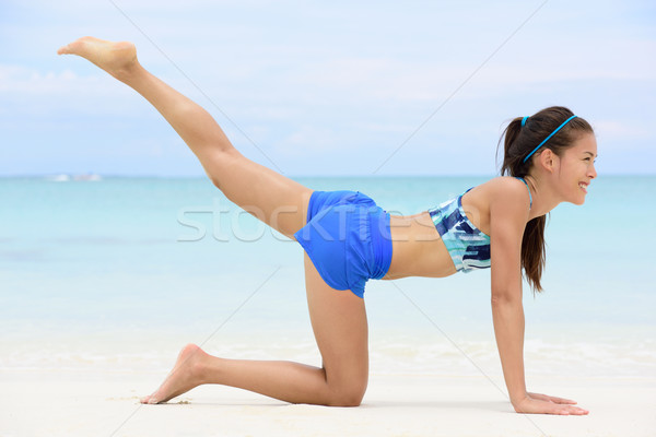 Leg lift butt toning exercise - fitness woman Stock photo © Maridav