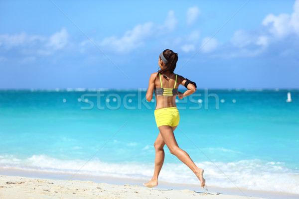 Running on beach - summer workout active lifestyle Stock photo © Maridav
