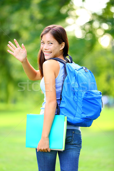 Woman student waving Stock photo © Maridav