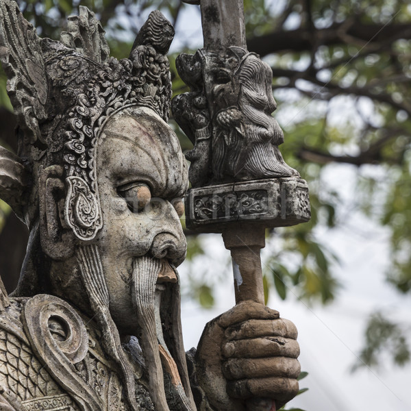 Stock photo: Statue of a Chinese warrior near an entrance of Wat Pho. Wat Pho