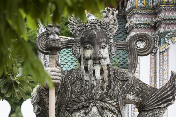 Statue of a Chinese warrior near an entrance of Wat Pho. Wat Pho Stock photo © Mariusz_Prusaczyk