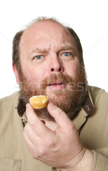 Diéta muffin ventillátor férfi bámul arc Stock fotó © markhayes