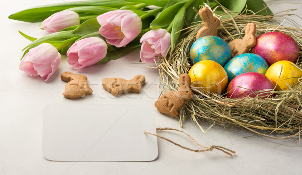 Easter eggs paglia nido coniglio pasquale cookies tulipani Foto d'archivio © markova64el