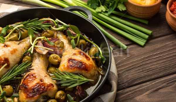 Stock photo: Dinner with baked chicken legs and vegetable. 